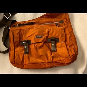 Tumi sling bag rust color